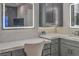 Close-up of a luxurious bathroom vanity with a lighted mirror and marble countertop at 1912 Glenview Dr, Las Vegas, NV 89134