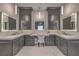Luxurious bathroom features dual sinks, elegant cabinetry, marble countertops, and a central vanity area at 1912 Glenview Dr, Las Vegas, NV 89134
