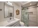 Bathroom featuring a modern vanity, sink, and walk-in shower with glass door at 1912 Glenview Dr, Las Vegas, NV 89134