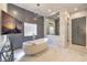 Luxurious bathroom featuring a freestanding tub, marble tile, and modern lighting at 1912 Glenview Dr, Las Vegas, NV 89134
