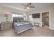 Well-lit bedroom features a king-size bed, an ensuite bathroom, and neutral decor at 1912 Glenview Dr, Las Vegas, NV 89134