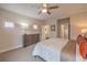 Bright bedroom with a king-size bed, neutral decor, and a view into an ensuite bathroom at 1912 Glenview Dr, Las Vegas, NV 89134