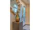 Stylish foyer featuring decorative glass doors, a statement mirror, and elegant decorative accents at 1912 Glenview Dr, Las Vegas, NV 89134