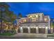 Beautifully lit two-story home with well-maintained landscaping, mature trees, and a spacious three-car garage at 1912 Glenview Dr, Las Vegas, NV 89134
