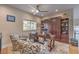 Stylish home office featuring a ceiling fan, a desk, and a comfortable seating area with patterned chairs at 1912 Glenview Dr, Las Vegas, NV 89134
