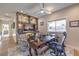Bright home office featuring a ceiling fan, built-in shelves, a window, a desk, and a comfortable chair at 1912 Glenview Dr, Las Vegas, NV 89134