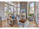 Sun-drenched living room with large windows, stylish fireplace, and comfortable seating arrangement at 1912 Glenview Dr, Las Vegas, NV 89134
