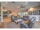 Open concept living room with direct access to kitchen, recessed lighting, ceiling fan, and comfortable seating at 1912 Glenview Dr, Las Vegas, NV 89134