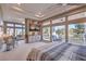 Bright main bedroom with sitting area and views of the lush exterior at 1912 Glenview Dr, Las Vegas, NV 89134