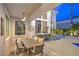 Covered outdoor dining space with ample seating and bar setup at 1912 Glenview Dr, Las Vegas, NV 89134