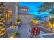 Stylish patio area with a modern fire pit and comfortable seating, perfect for outdoor entertaining under the night sky at 1912 Glenview Dr, Las Vegas, NV 89134