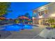 Illuminated backyard pool at dusk with well-appointed outdoor area at 1912 Glenview Dr, Las Vegas, NV 89134