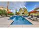 Refreshing pool with lounge chairs and umbrellas, perfect for outdoor living at 1912 Glenview Dr, Las Vegas, NV 89134