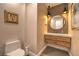 Modern powder room with floating vanity, custom wallpaper, and attractive lighting fixtures at 1912 Glenview Dr, Las Vegas, NV 89134