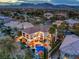 Expansive home featuring a pool, outdoor seating, and lush landscaping in a serene neighborhood setting at 1912 Glenview Dr, Las Vegas, NV 89134