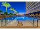 Outdoor pool with lounge chairs, palm trees, and views of the city skyline at 2000 Fashion Show Dr # 2604, Las Vegas, NV 89109