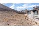 View of the backyard with a block wall and partial patio at 2222 Little River Ct, Las Vegas, NV 89156