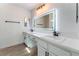 Bathroom featuring double vanity, illuminated mirror, and modern finishes at 2222 Little River Ct, Las Vegas, NV 89156