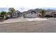 Attractive house with a 2-car garage, desert landscaping, and mountain backdrop at 2222 Little River Ct, Las Vegas, NV 89156