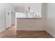 Kitchen view with sleek white cabinets and modern pendant lighting at 2222 Little River Ct, Las Vegas, NV 89156
