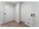 Functional laundry room with vinyl flooring and convenient hookups at 2222 Little River Ct, Las Vegas, NV 89156