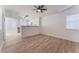 Bright living area with wood floors and an open view of the kitchen at 2222 Little River Ct, Las Vegas, NV 89156