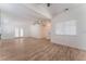 Spacious living room with wood floors, modern design, and lots of natural light at 2222 Little River Ct, Las Vegas, NV 89156