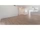 Spacious living area with wood floors and open layout to the kitchen at 2222 Little River Ct, Las Vegas, NV 89156
