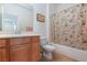 Bathroom featuring tile floors, a vanity, and a shower-tub combo at 2341 Rosendale Village Ave, Henderson, NV 89052