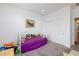 Bedroom featuring a twin bed, carpet, and white closet doors at 2341 Rosendale Village Ave, Henderson, NV 89052