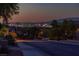 Scenic street with a clear view of the city lights at night at 2341 Rosendale Village Ave, Henderson, NV 89052