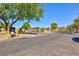 View of an elegant community entry gate with landscaped surroundings, providing privacy and security at 2341 Rosendale Village Ave, Henderson, NV 89052