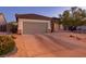 Charming single-story home featuring desert landscaping, a two-car garage, and a welcoming entrance at 2341 Rosendale Village Ave, Henderson, NV 89052