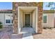 Charming entryway with stone accents and a covered porch at 2341 Rosendale Village Ave, Henderson, NV 89052