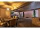 A covered patio dining area offers a relaxing outdoor setting with a table, chairs, and a built-in BBQ area at 2341 Rosendale Village Ave, Henderson, NV 89052