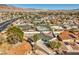 A suburban home with a spacious lot, mature trees, and inviting curb appeal, is conveniently located near schools and parks at 2450 Tournament St, Las Vegas, NV 89142