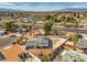 A well-situated property features a spacious yard, mature landscaping, and convenient access to nearby amenities and thoroughfares at 2450 Tournament St, Las Vegas, NV 89142