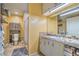 This bathroom features a tile countertop, under sink storage, and an open shower space at 2450 Tournament St, Las Vegas, NV 89142