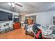 A spacious bedroom showcases wood floors, a ceiling fan, and a full dresser with a large television at 2450 Tournament St, Las Vegas, NV 89142