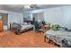 This spacious bedroom features wood floors, two beds, and ample room for a desk or other furniture at 2450 Tournament St, Las Vegas, NV 89142