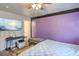 Bedroom with a wall-mounted television and a table for gaming at 2450 Tournament St, Las Vegas, NV 89142