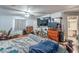 This large bedroom features wood floors, two beds, multiple dressers, and two televisions at 2450 Tournament St, Las Vegas, NV 89142