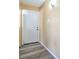 Bright entryway with wood-look floors and a white front door and fresh paint at 2450 Tournament St, Las Vegas, NV 89142
