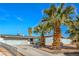 Cozy single-story home with a long driveway, xeriscaped front yard featuring desert vegetation and a charming fence at 2450 Tournament St, Las Vegas, NV 89142