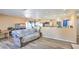 Spacious living room area showcasing wood-look floors and open concept to the kitchen at 2450 Tournament St, Las Vegas, NV 89142