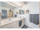 Well-lit bathroom with a double sink vanity and modern fixtures at 2540 Hummingbird Hill Ave, Henderson, NV 89074