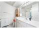 Bathroom featuring a white vanity with a sink, toilet, and shower-tub combo at 2540 Hummingbird Hill Ave, Henderson, NV 89074