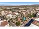 Charming community featuring Mediterranean-style architecture, a pool, and lush green spaces from above at 2555 Hampton Rd # 4204, Henderson, NV 89052