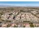 A scenic aerial view of a community showcasing the lush landscape and architectural design against a mountain backdrop at 2555 Hampton Rd # 4204, Henderson, NV 89052