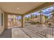 Balcony overlooking manicured landscaping with palm trees and well-maintained buildings at 2555 Hampton Rd # 4204, Henderson, NV 89052